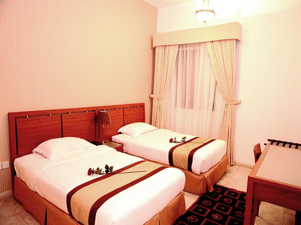Arcadia Hotel Suites Sharjah Værelse billede